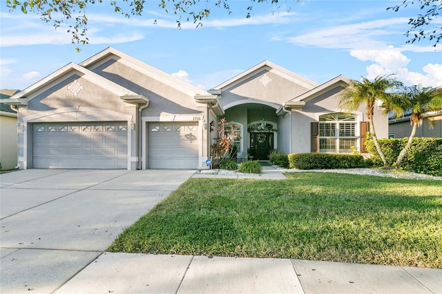 single story home with a garage and a front lawn