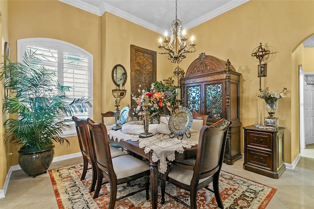 tiled dining area featuring crown molding and a notable chandelier