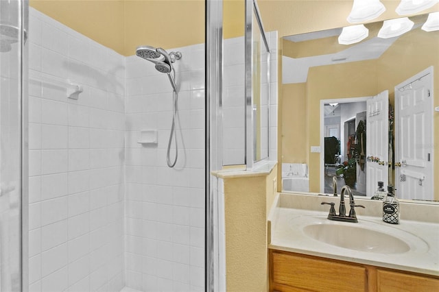 bathroom with vanity and a shower with shower door