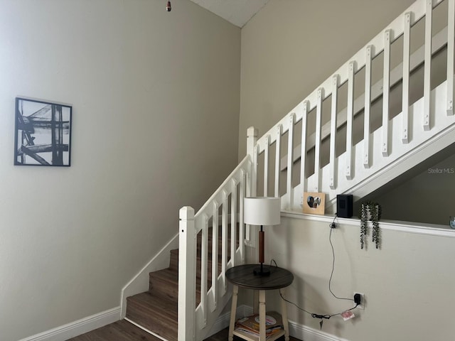 stairway featuring hardwood / wood-style flooring