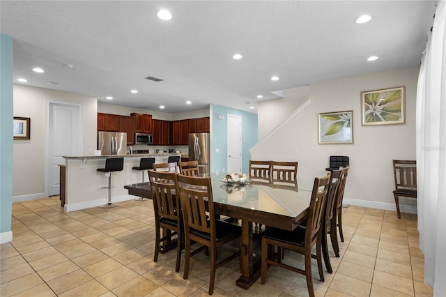 dining area with light tile patterned floors