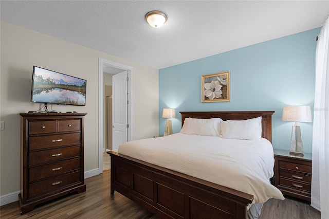 7639 Wilmington Loop, Kissimmee, FL 34747 - bedroom with dark wood finished floors