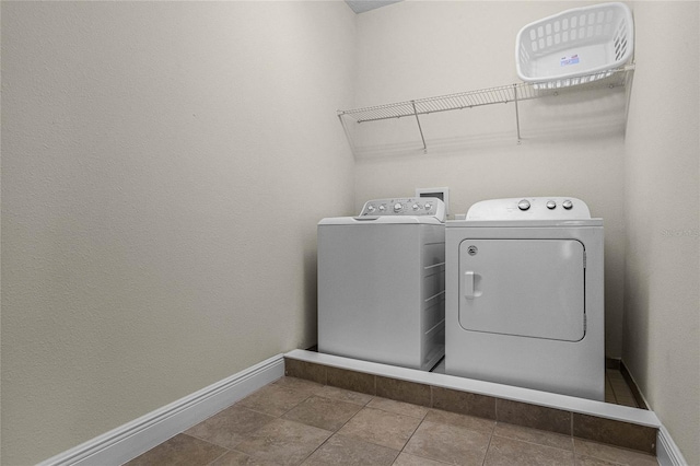 washroom with tile patterned floors and separate washer and dryer