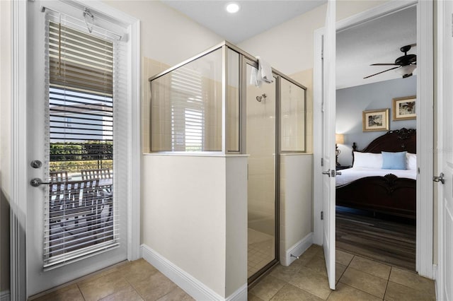 bathroom featuring tile patterned floors, ceiling fan, and an enclosed shower