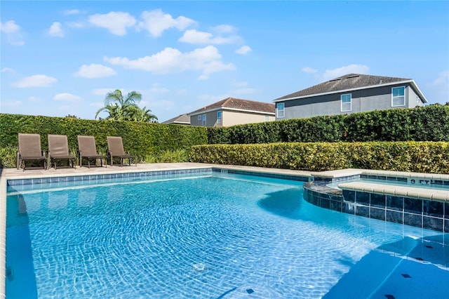 7639 Wilmington Loop, Kissimmee, FL 34747 - view of pool featuring a pool with connected hot tub