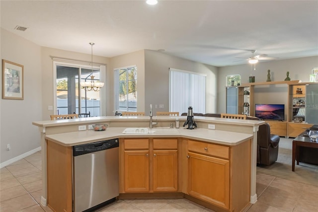 kitchen with dishwasher, sink, hanging light fixtures, a kitchen island with sink, and ceiling fan with notable chandelier