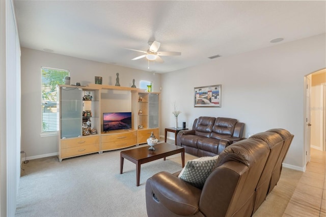 living room with ceiling fan and light carpet