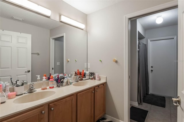 bathroom featuring vanity and tile patterned floors