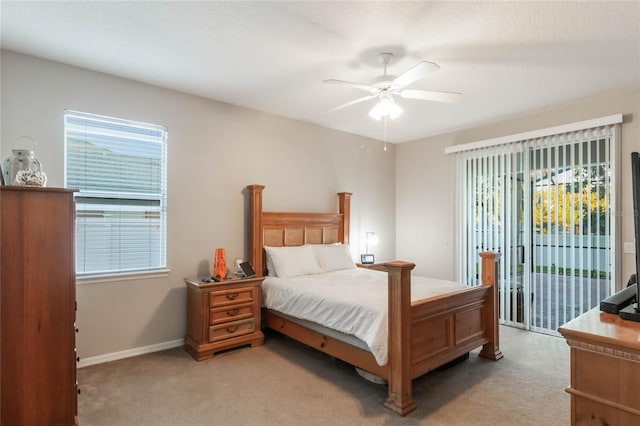 carpeted bedroom featuring access to exterior, ceiling fan, and a textured ceiling