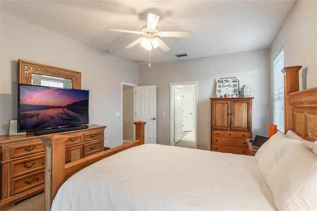 bedroom with ceiling fan and carpet