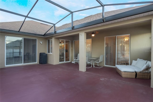 view of patio / terrace featuring a lanai