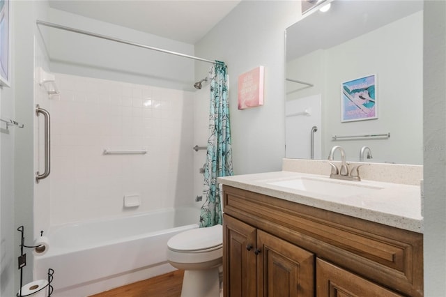 full bathroom featuring shower / bathtub combination with curtain, hardwood / wood-style floors, vanity, and toilet