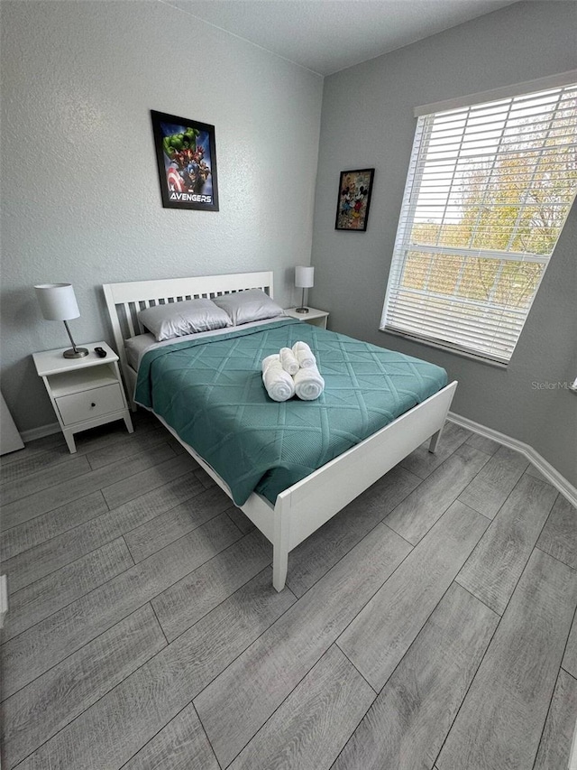 bedroom with hardwood / wood-style flooring