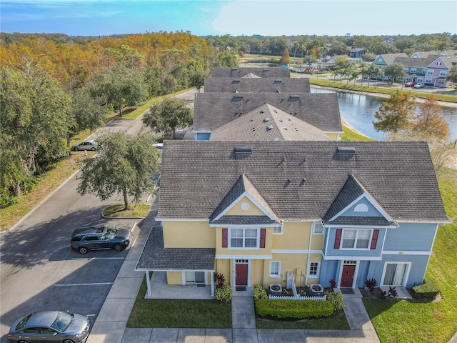 birds eye view of property with a water view