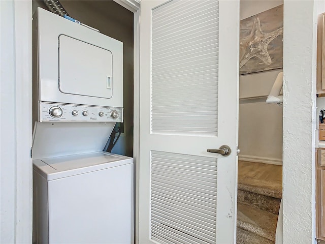 laundry room featuring stacked washing maching and dryer