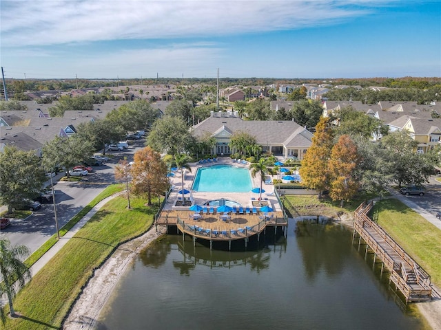 birds eye view of property with a water view