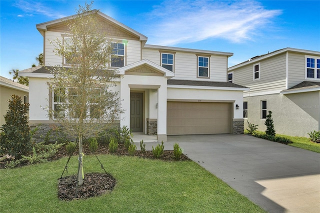 view of front of home with a garage and a front lawn