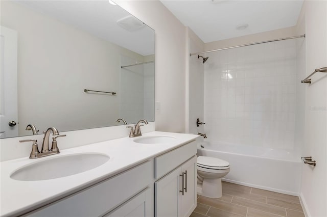 full bathroom featuring vanity, toilet, and shower / washtub combination