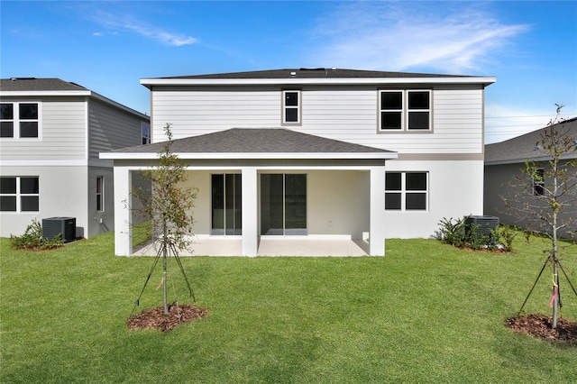 back of house with a yard, a patio, and central air condition unit