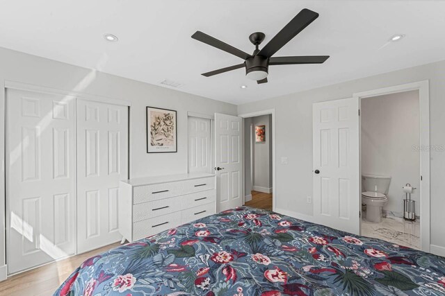 bedroom featuring ceiling fan, wood-type flooring, and connected bathroom