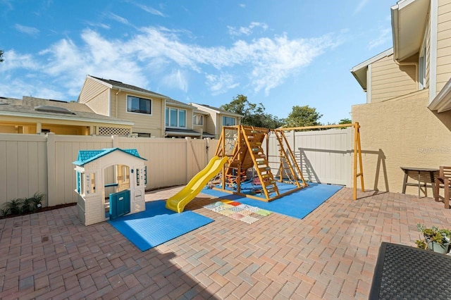 view of play area with a patio