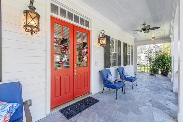 doorway to property featuring ceiling fan