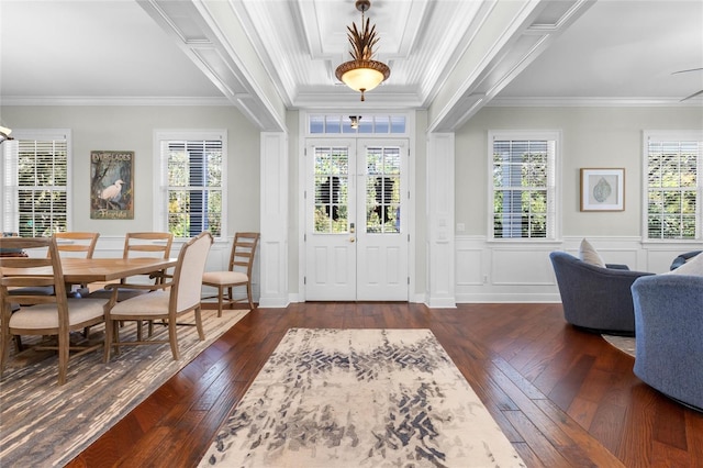 foyer entrance with crown molding, french doors, and dark wood-type flooring