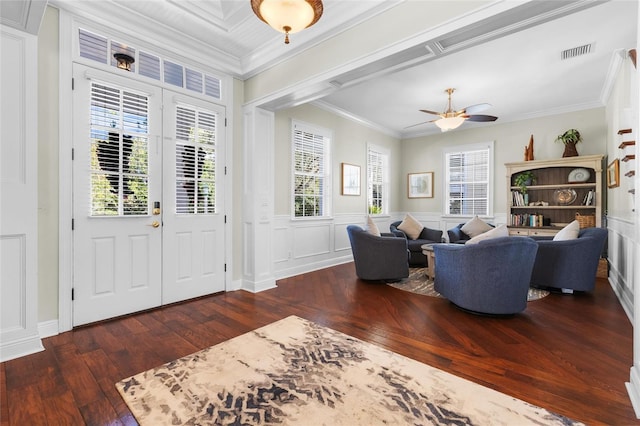 living room with ceiling fan, dark hardwood / wood-style flooring, and ornamental molding