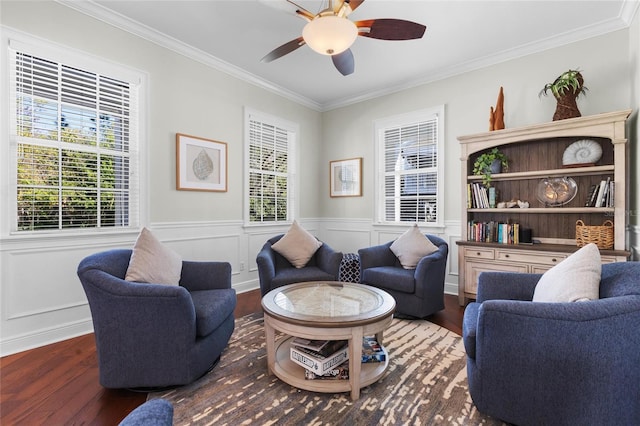 living room with crown molding, ceiling fan, and dark hardwood / wood-style floors