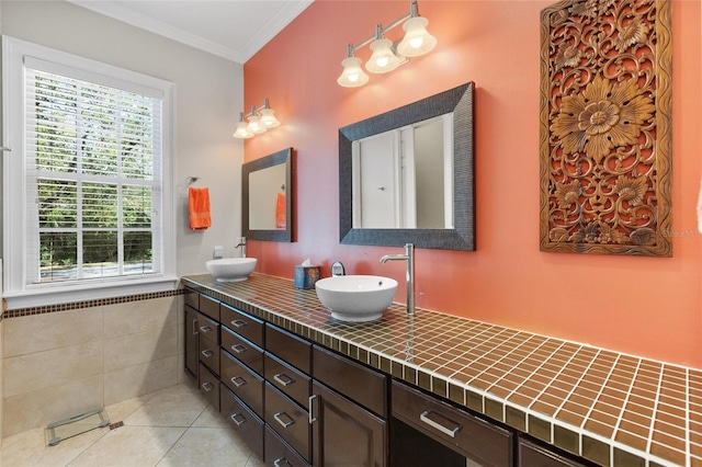 bathroom with tile patterned flooring, vanity, and ornamental molding