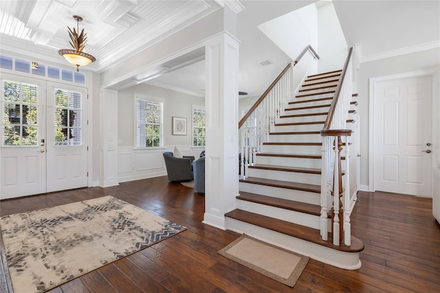 foyer with dark hardwood / wood-style floors and crown molding