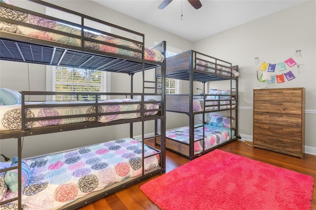 bedroom with ceiling fan and hardwood / wood-style flooring