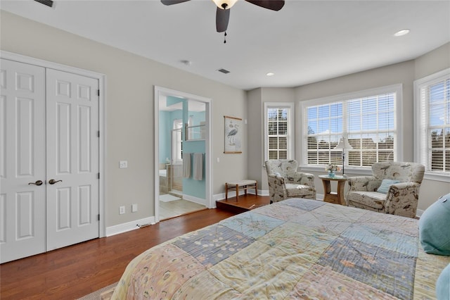 bedroom with ceiling fan, ensuite bathroom, and hardwood / wood-style flooring