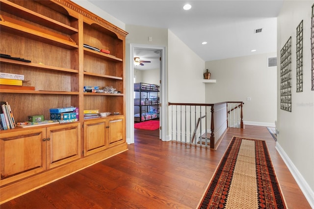 hall with dark hardwood / wood-style flooring