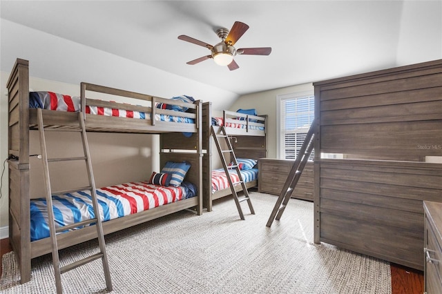 bedroom with ceiling fan and lofted ceiling