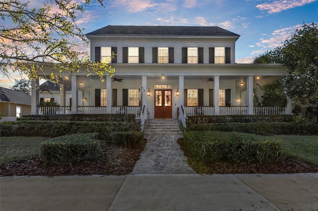 view of front of house featuring ceiling fan and covered porch