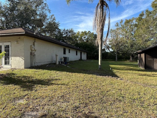 view of yard featuring central AC