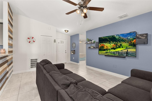 825 Desmoines Pl, Kissimmee, FL 34759 - living area with ceiling fan, light tile patterned flooring, lofted ceiling, and baseboards