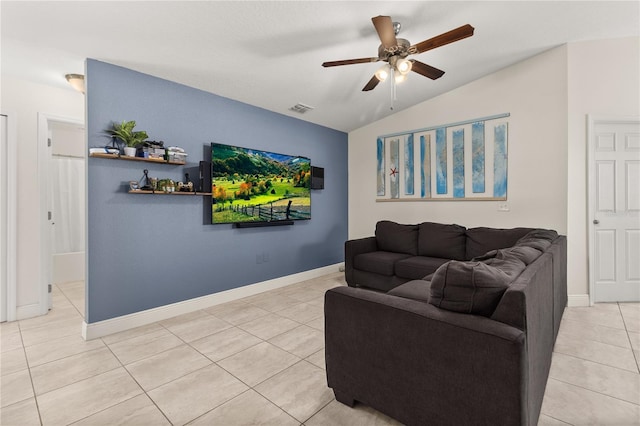 living room with ceiling fan, light tile patterned floors, and lofted ceiling