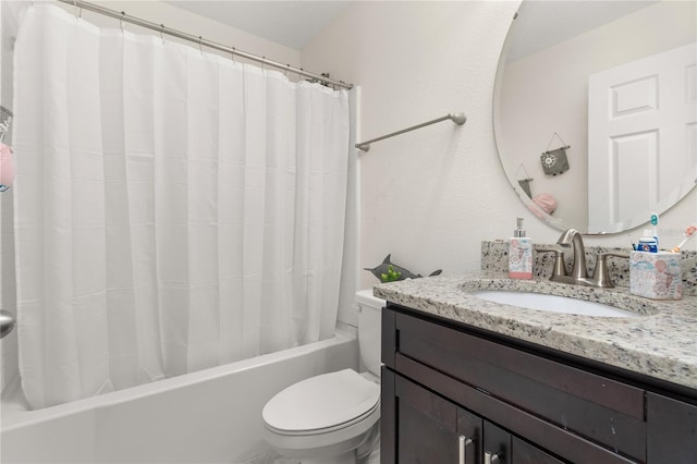 full bathroom featuring shower / bath combo, vanity, and toilet