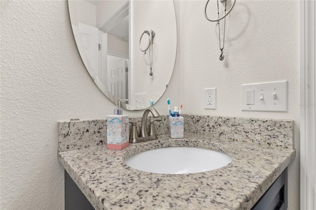 825 Desmoines Pl, Kissimmee, FL 34759 - bathroom featuring vanity and a textured wall