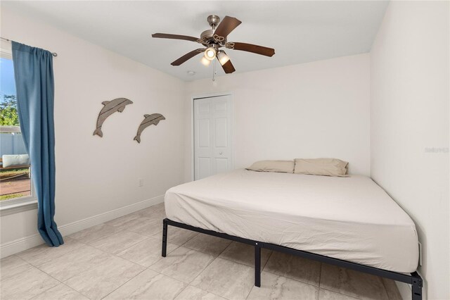 bedroom with a closet and ceiling fan