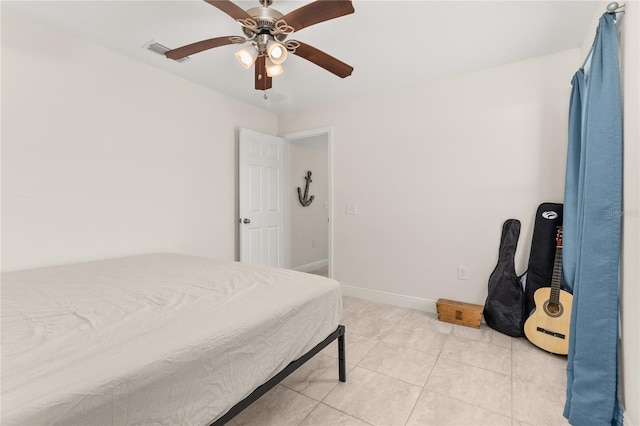 bedroom featuring ceiling fan and light tile patterned floors