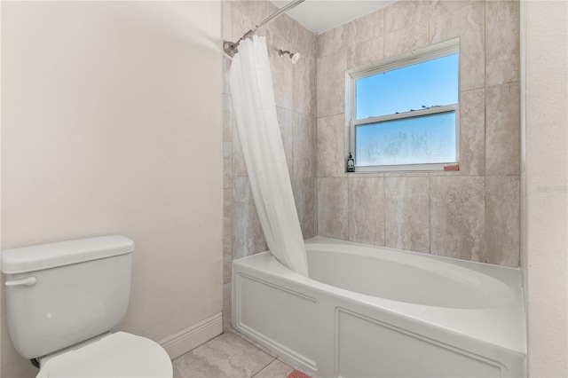 bathroom featuring tile patterned floors, shower / bath combo, and toilet