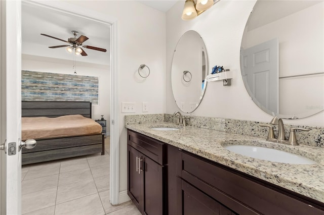 bathroom featuring tile patterned floors, ceiling fan, and vanity