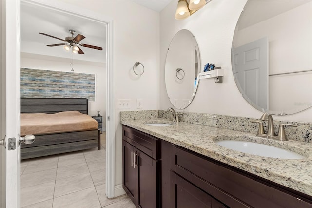 825 Desmoines Pl, Kissimmee, FL 34759 - ensuite bathroom with ceiling fan, double vanity, and tile patterned floors
