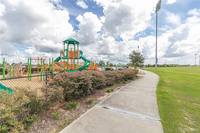 view of playground featuring a lawn