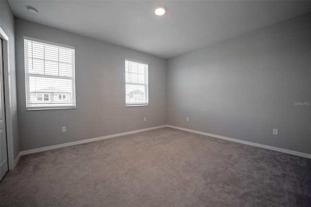 empty room with carpet and a healthy amount of sunlight