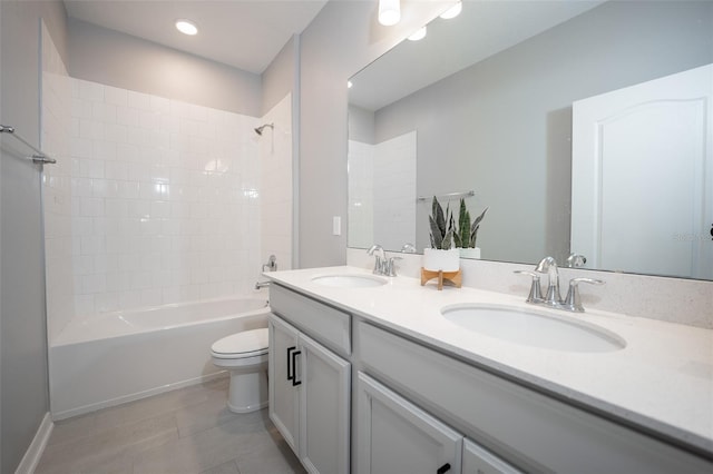 full bathroom with vanity, tile patterned floors, tiled shower / bath combo, and toilet