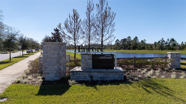 exterior space featuring a yard and a water view